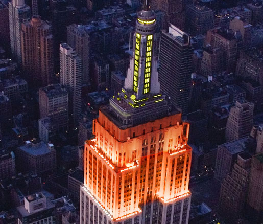 The Empire State Building shining orange and yellow for the James Beard Foundation