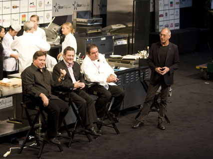 Norman Van Aken, Charlie Trotter, and Emerill Lagasse participate in a keynote panel led by Clark Wolf.