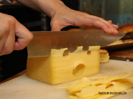 Slicing cheese at a Beard House dinner.
