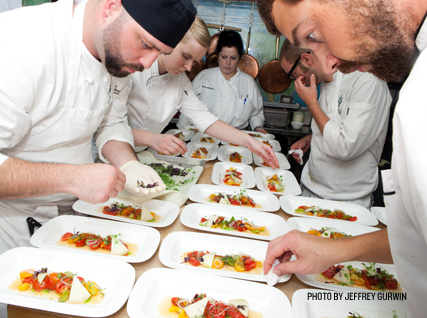Busy plating dishes at a Beard House dinner.