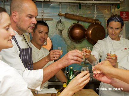 Christian Caiazzo of Osteria Stellina celebrates with a shot in the Beard House kitchen