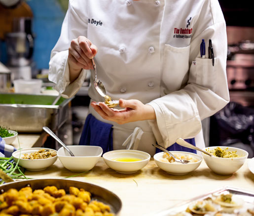 A student volunteer in the James Beard House kitchen