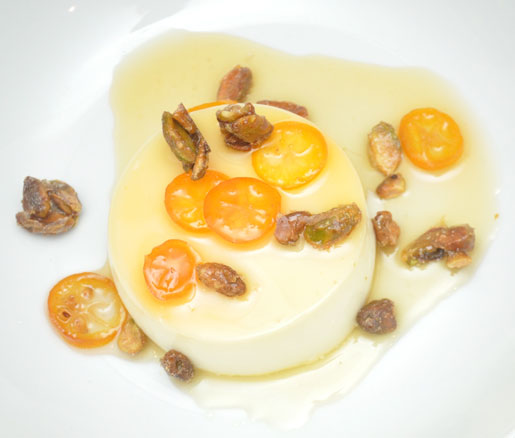 Bronwen Wyatt's recipe for Meyer Lemon Panna Cotta with Candied Kumquats and Sea Salt–Roasted Pistachios, apdated by the James Beard Foundation