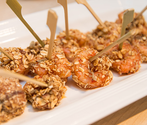 Bitters-Poached Gulf Shrimp with Toasted Oats, Honey, and Candied Pecans